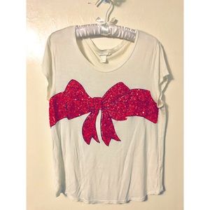 Red sequined bow shirt.